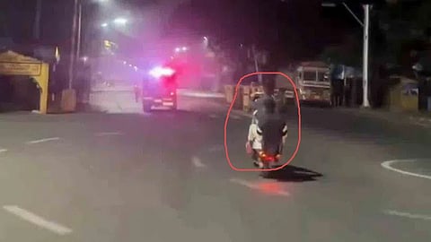 youths performing dangerous bike wheelies right in front of police