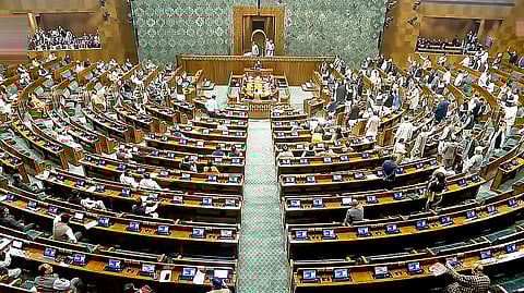 Opposition MPs protest in the Lok Sabha during the Budget session of Parliament, in New Delhi, Thursday, Feb. 5, 2026.