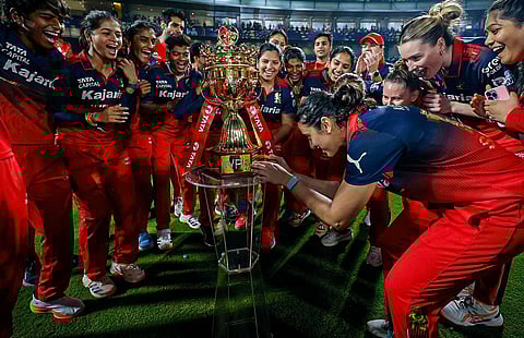 RCB Team members with WPL 2026 trophy