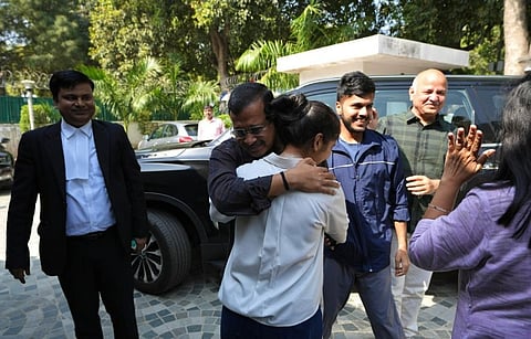 AAP national convenor Arvind Kejriwal and party leader Manish Sisodia celebrate with family members