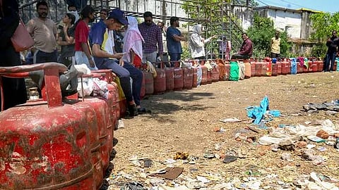Peole line up with empty cylinder in Bhopal