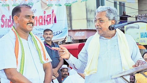 Karnataka CM Siddaramaiah with UDF candidate AKM Ashraf at an election rally in Manjeshwar assembly constituency of Kasaragod, Kerala on Sunday