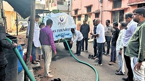 Members of Pyaas Foundation supply drinking water at Gajapati village in Belagavi district
