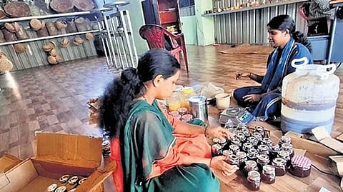 Women package the wild honey procured by Koraga tribals