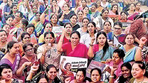 Union Minister of State Shobha Karnadlaje and Nari Shakti Forum members protest against the Congress in Bengaluru on Saturday.