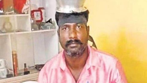 ಪಾತ್ರೆಗಳನ್ನು ಹಿಡಿದ ಚಾಲಕ