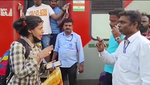 ಮಹಿಳೆಯೊಂದಿಗೆ ಮಾತಿನ ಚಕಮಕಿ ನಡೆಸುತ್ತಿರುವ ಸಂತೋಷ್ ಕುಮಾರ್.