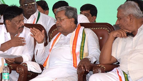 Chief Minister Siddaramaiah with Congress leaders at an election rally in Chamarajanagar on Friday
