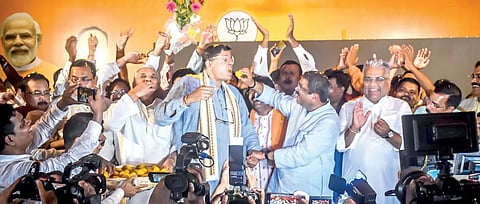 Jubilant BJP leaders Dharmendra Pradhan, Baijayant Panda and Union minister Bhupendra Yadav seen celebrating their victory with sweets in Bhubaneswar on June 4