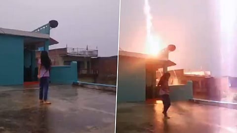 Girl narrowly avoids lightning strike while filming reel