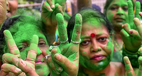 TMC supporters celebrate as party candidate Supti Pandey from Maniktala constituency leads during counting of votes for Assembly by-election, in Kolkata, Saturday, July 13, 2024. 