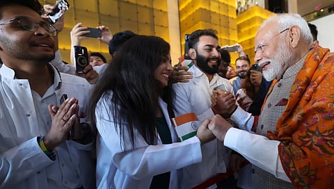 Prime Minister Narendra Modi greets at supporters as they welcome him on their arrival in Kyiv, Ukraine, Friday, Aug. 23, 2024.