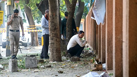 Forensic experts collect samples from the site after a blast was reported at Prashant Vihar, near CRPF school in Rohini area of New Delhi, Sunday, Oct 20, 2024.