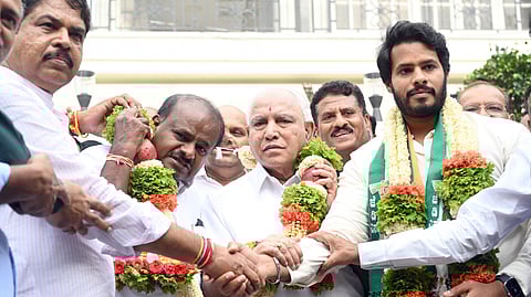 LoP in Assembly R Ashoka, Union Minister HD Kumaraswamy, former chief minister BS Yediyurappa, and NDA candidate from Channapatna, Nikhil Kumaraswamy, pose for shutterbugs, in Bengaluru on Thursday