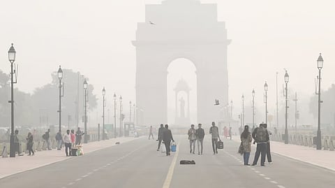A view of India Gate shrouded by dense smog at Kartavya Path in New Delhi on Tuesday.