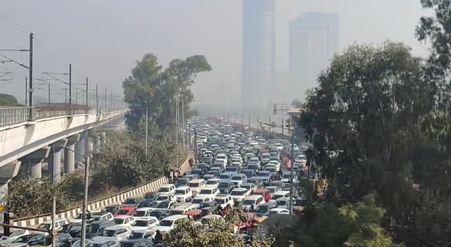 Vehicles stuck in a traffic jam on a road near Delhi-Noida border, at Kalindi Kunj, in New Delhi, Monday.