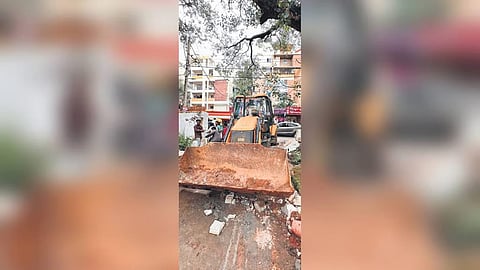 An earthmover at the site of the demolition in Whitefield 