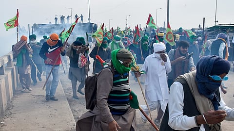 Tear gas being used to disperse protesting farmers at Shambhu Border during their foot march towards Delhi, in Patiala district, Sunday