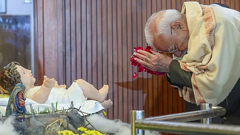 Prime Minister Narendra Modi offers prayers during Christmas celebrations hosted by the Catholic Bishops' Conference of India, in New Delhi, Monday, Dec. 23, 2024
