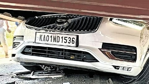container truck toppled and crushed their car 