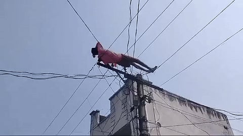 A drunk youth in Andhra Pradesh climbed an electricity transmission pole