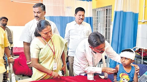 MLA SN Narayanaswamy speaks with an injured student at a hospital in Bangarpet on Saturday.