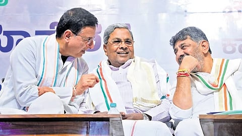 AICC general secretary Randeep Singh Surjewala shares a light moment with Chief Minister Siddaramaiah and Deputy Chief Minister DK Shivakumar during a meeting at Bharat Jodo Bhavan in Bengaluru on Monday.