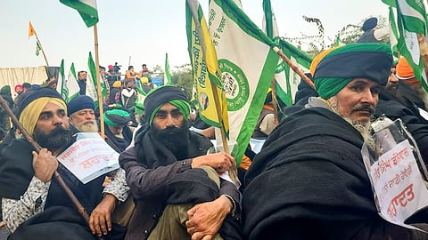 Farmers wear black clothes during their protest at the Khanauri border