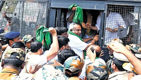 BJP leaders and workers being detained by police in front of Animal Husbandry Minister K Venkatesh’s residence i