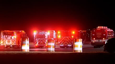 Emergency equipment stages at Gravelly Point, north of Ronald Reagan Washington National Airport, along the Potomac River, Wednesday.