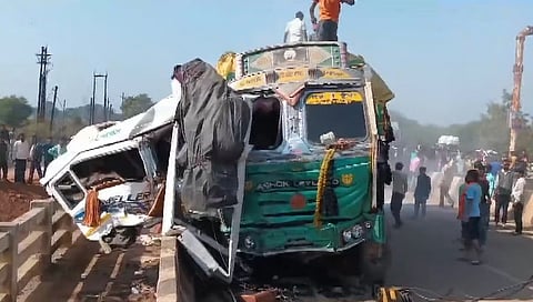 Mangled remains of vehicles after a bus carrying devotees collided with a truck near Sihora, 