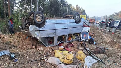 vehicle carrying workers overturns