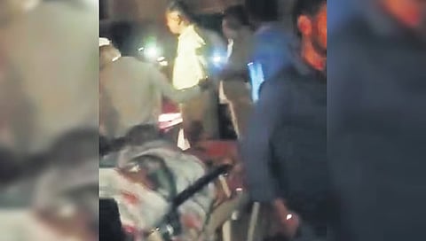 Doctors use smartphone torchlights to treat a patient in Ballari 
