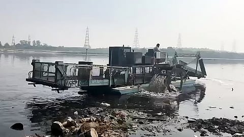 Trash Skimmer conducts a cleaning operation of Yamuna River, in New Delhi on Sunday