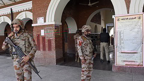 Paramilitary soldiers stand guard at a railway station in the Sibi district of southwestern Balochistan province on March 12, 2025, during a security operation against militants a day after they hijacked a passenger train.