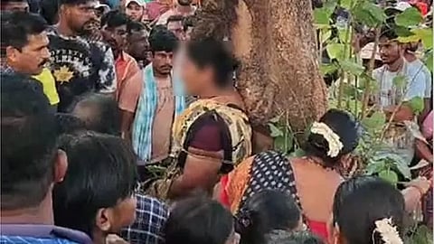 tying woman to tree