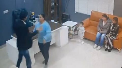 Self-styled pastor Bajinder Singh is seen throwing objects and slapping a man and a woman