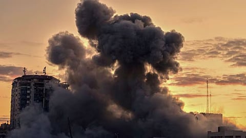 Smoke rises from a building after it was targeted by an Israeli army strike