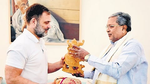 Chief Minister Siddaramaiah presents a memento to LoP in Lok Sabha Rahul Gandhi in New Delhi on Thursday.