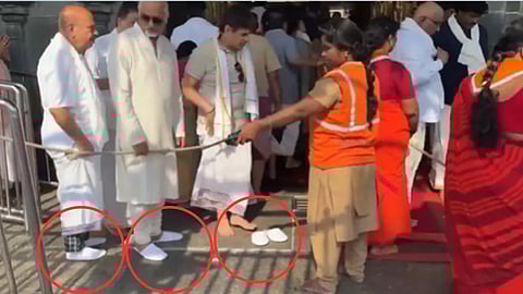 Devotees enter the main gate of Tirumala Srivari Temple wearing slippers