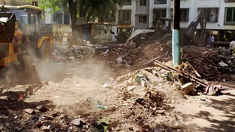 A bulldozer being used to demolish an allegedly illegal dargah, in Nashik district, Maharashtra, Wednesday, April 16, 2025. 