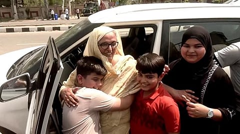Children welcome their grandmother who returned from Pakistan, at Attari Border in Amritsar
