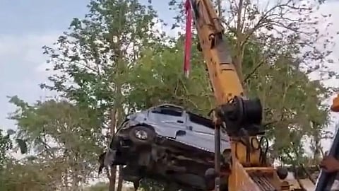 van plunged into a water-filled well