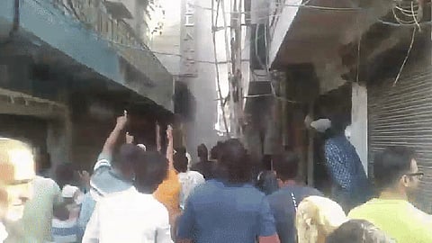 A woman reportedly threw her child from a window to save it as the fire broke out