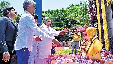 Chief Minister Siddaramaiah offers floral tributes to the statue of Dr BR Ambedkar in Yelahanka on Saturday.