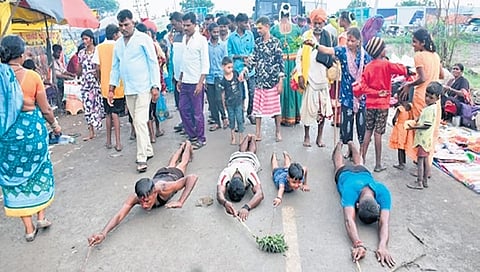 Devotees prostrate at the Dandina Durgamma fair