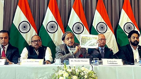 Congress MP Shashi Tharoor speaking to reporters in Bogota.