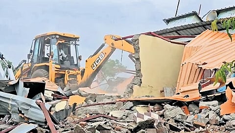 A bulldozer razes self-proclaimed seer Hathyogi Lokeshwar Swami’s illegal Ram Mandir Mutt