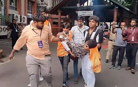 An injured being taken for treatment following chaos near the Chinnaswamy Stadium