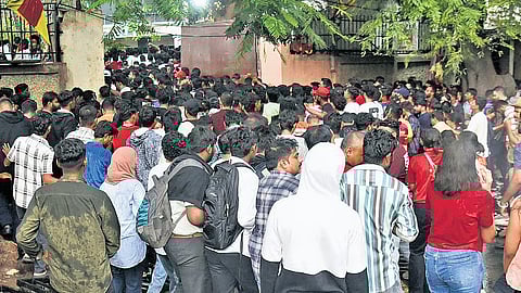 People gather outside M Chinnaswamy Stadium